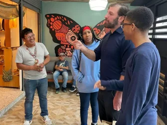 Go! International Founder Seth Hamilton and students meet members of the Wao community.