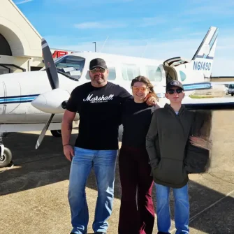 Austin’s first Wings of Hope flight (shown with dad and sister)